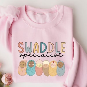 Swaddle Specialist Sweatshirt, Labor And Delivery Sweastshirt, NICU Nurse Hoodie, Neonatal ICU Registered Nurse, Nurse Tee, Nursing Outfit