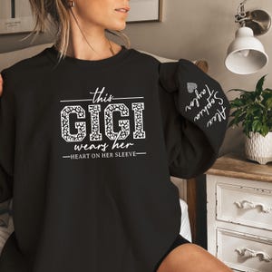 This Gigi Wears Her Heart On Her Sleeve Sweatshirt for Mothers Day, Custom Gigi Sweatshirt with kids Name on Sleeve, Mother Day Gift for Mom