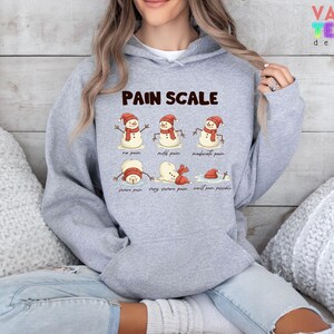 Christmas Nurse Sweatshirt: Funny Pain Scale Hoodie image 6