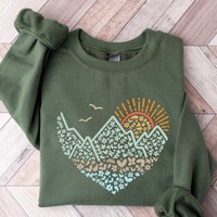 The Snow Is Falling And The Mountains Are Calling Sweatshirt