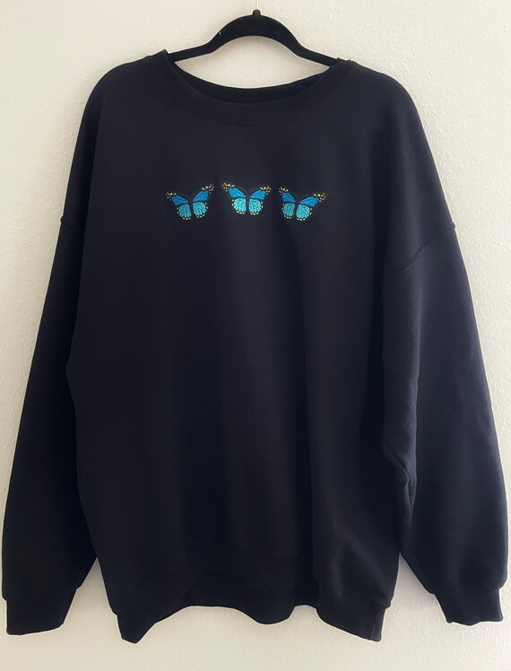 Black sweatshirt with blue butterfly sale