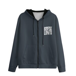 May include: A dark grey zip-up hoodie with a black interior lining and the white text "BREAK LIMITS". The hoodie has a full-length zip and two front pockets. The hoodie is made of a soft, comfortable material.