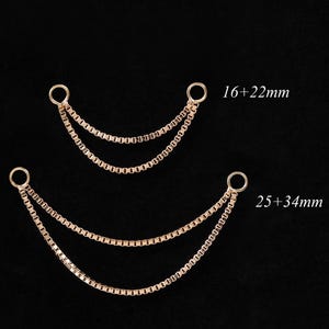 May include: Two gold-colored chain connectors with two strands each, connected by small rings. The top connector is labeled "16+22mm" and the bottom connector is labeled "25+34mm". The background is black.