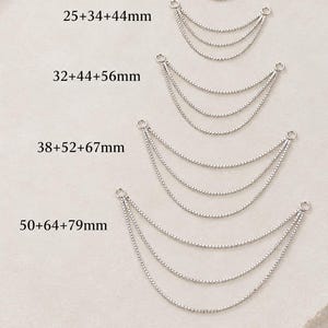 May include: Five silver-toned multi-strand chain connectors arranged by size. Each piece features three draped chains attached to two circular jump rings. Text labels indicate lengths of 16+22+28mm, 25+34+44mm, 32+44+56mm, 38+52+67mm, and 50+64+79mm.