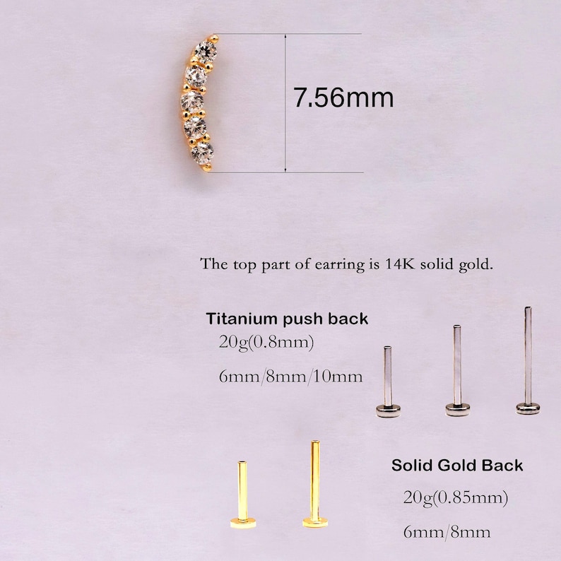 May include: A curved gold earring top with five clear stones measuring 7.56mm. Includes titanium push backs in 20g 0.8mm at 6mm, 8mm, and 10mm lengths, and solid gold backs in 20g 0.85mm at 6mm and 8mm lengths. Text states top is 14K solid gold.