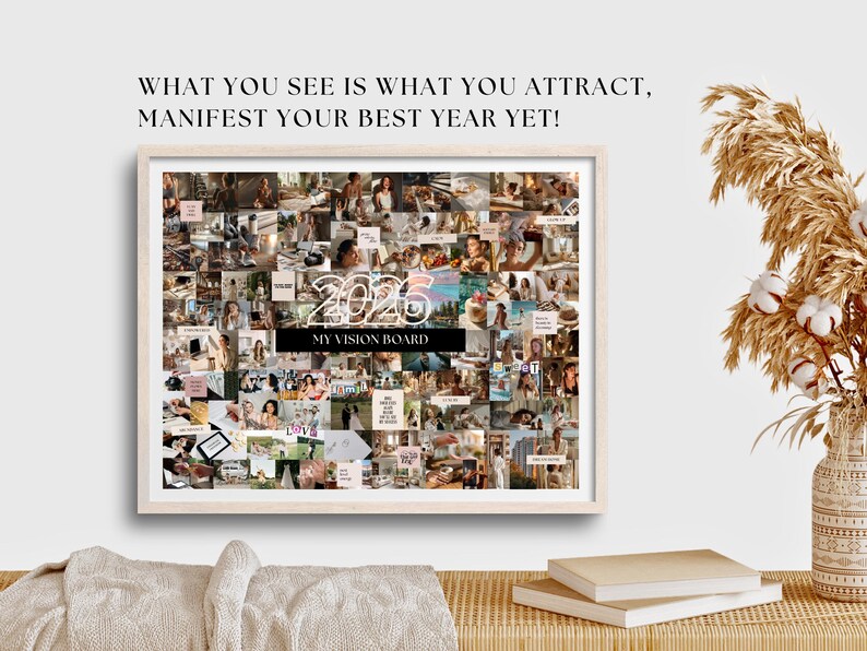 May include: A framed vision board with a collage of images, the year "2026" and the text "MY VISION BOARD". The text "WHAT YOU SEE IS WHAT YOU ATTRACT, MANIFEST YOUR BEST YEAR YET!" is at the top. The frame is light-coloured.