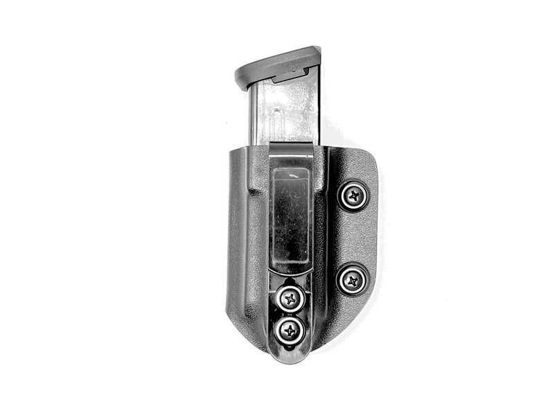 May include: A black polymer magazine holster with a silver magazine inside. The holster has four screws on the side.