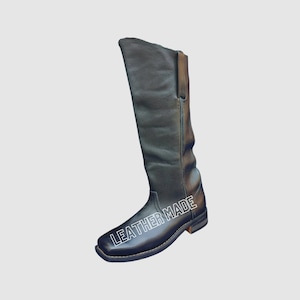 May include: Black leather knee-high boots with a pointed toe and a small heel. The boots have a zipper on the side and the text "LEATHER MADE" is printed on the side of the boot.
