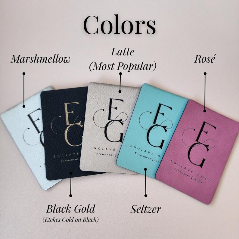 a collection of five different colored leather tags or coasters, each with a unique color and design.