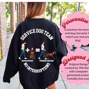 Può includere: Felpa nera con la scritta "SERVICE DOG TEAM" e una grafica di una persona e un cane. Il design include le frasi "BEFORE SUPPORT" e "STRONGER TOGETHER". La felpa ha anche la scritta "NO INTERRUPTIONS".