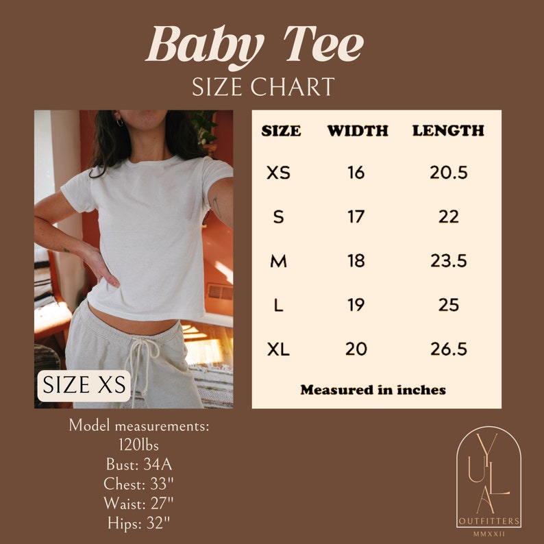 May include: Size chart for a white baby tee with a model wearing the tee in size XS. The chart shows measurements in inches for sizes XS, S, M, L, and XL. The model is 120 lbs, with a 34A bust, 33 inch chest, 27 inch waist, and 32 inch hips.