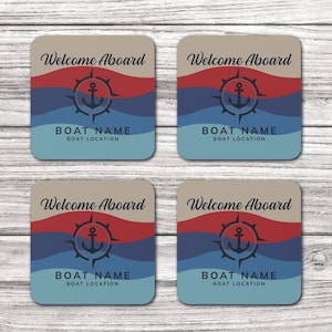 May include: Four square coasters with a nautical theme. Each coaster features a compass with an anchor in the center, blue and red waves, and the text "Welcome Aboard". The text "BOAT NAME" and "BOAT LOCATION" are also included on each coaster.