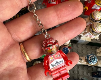 Michael Schumacher nyckelring 2000 världsmästare Ferrari F1 formel 1 Grand Prix pilotfigur förardräkt hjälm minifigur minifigur