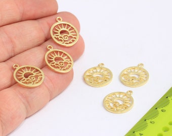 May include: Five gold-coloured metal charms featuring a sun and clouds design. The charms are approximately 2.5 cm in diameter and have a hole at the top for attaching to a necklace or bracelet.