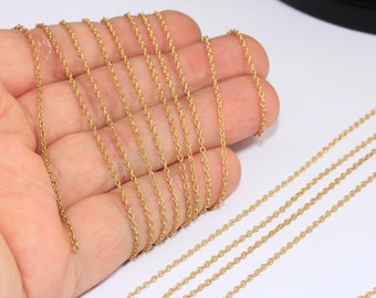 May include: A close-up of multiple strands of gold-coloured chain, likely for jewellery making. The chain is delicate and has a rope-like texture.