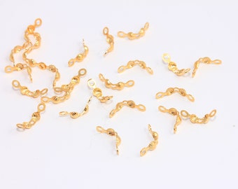 May include: A group of 20 gold-colored metal bead caps. The caps are shaped like a half-circle and have a textured surface. They are used for jewelry making.