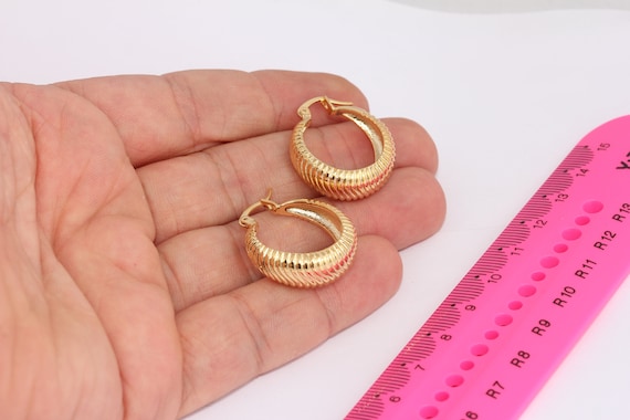 Shiny gold best sale earrings