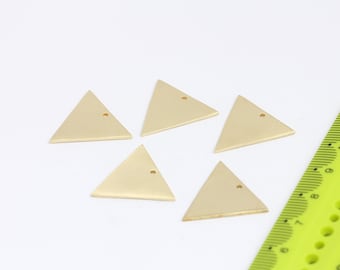 May include: Five gold-coloured triangle-shaped metal charms with a small hole in the centre of each.