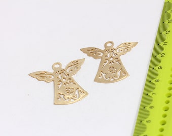 May include: Two gold metal angel charms with intricate cut-out designs. The charms are about 2 inches tall and have a hole at the top for hanging.