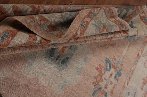 Muted Rustic Oushak Rug | Peach Tan Field Carpet, Blue and Cream Floral Geometric Motifs, Red and Green Accents | Hand Knotted Boho Style