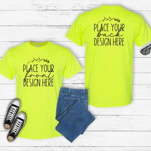 May include: Two neon yellow t-shirts with short sleeves. The front t-shirt has the text "Place your front design here" and a small floral design. The back t-shirt has the text "Place your back design here" and a small floral design.