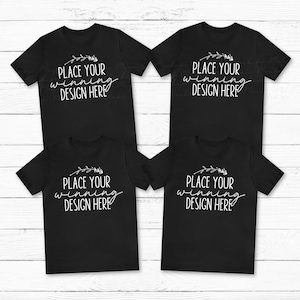 May include: Four black t-shirts with short sleeves and a white graphic that says "Place your winning design here" on each shirt.
