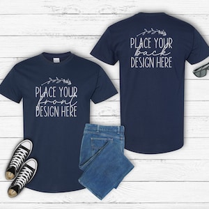 May include: Two navy blue t-shirts with short sleeves, one with the text "Place your front design here" and the other with the text "Place your back design here".
