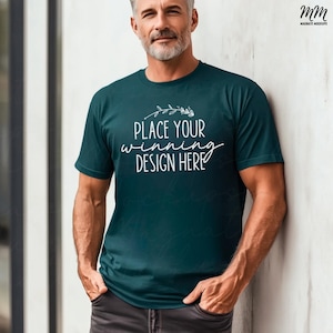 May include: A teal blue t-shirt with a white floral design and the text "Place your winning design here".