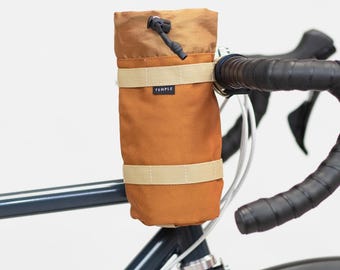 Outer shell roll top saddle bag marigold