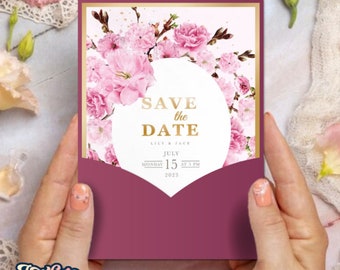 Könnte beinhalten: Eine rosafarbene und goldene Save-the-Date-Karte mit floralem Design. Der Text lautet "Save the Date" mit den Namen "Lily & Jack" und dem Datum "July 15, 2023 at 5 PM".