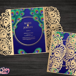 May include: A gatefold wedding invitation featuring intricate gold laser-cut peacock feather patterns. The deep blue centre panel displays the text MARIE AND JOHNNY, 17.08.20, YOUR PLACE HERE, and additional placeholder text within a gold circular frame.