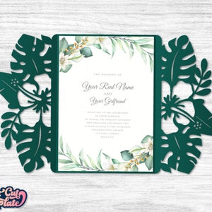 May include: Green tropical leaf laser cut wedding invitation with a white background and text that reads "The Wedding of Your Real Name and Your Girlfriend".