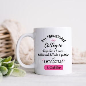Può includere: Tazza in ceramica bianca con un design nero e rosa che recita "UNE FORMIDABLE Collègue Trop dur à trouver tellement difficile à quitter et IMPOSSIBLE à Oublier".