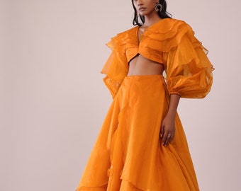 Flowy Organza Skirt With Delicate Frills And A Frill Top With Equally Gorgeous Sleeve Details Make Up This Lovely Mustard Yellow Lehenga Set