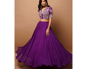 A Purple Heavy Organza Lehenga with Handwork Mirror V Blouse and Circular Lehenga set for women sounds like a stunning and elegant choice.