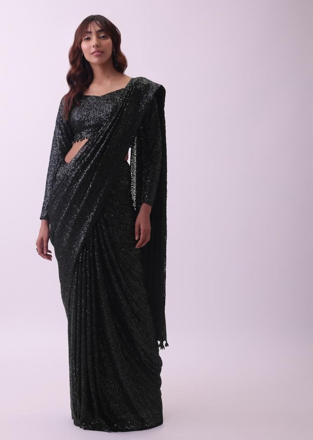 Designer Black Sequins Saree and Blouse With Sequence Crystal Detailing is an Exquisite and Glamorous Ethnic Ensemble That Exudes... 