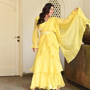 Yellow Indowestern ready-to-wear sari for women with a designer blouse and belt in yellow ruffles for wedding haldi reception and party wear