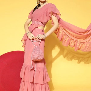Designer Pink Gorgeous Ruffle Georgette Saree for a Theatrical and Classy Look Wear our gorgeous Ruffle Georgette Saree to turn heads.