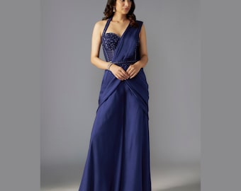Blue pre-draped Sharara saree with handwork corset blouse worn at weddings, parties, and engagements.