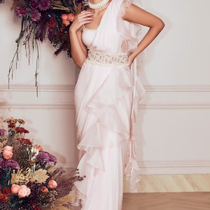 White Georgette Ruffle Saree: Pearl Detail Sleeveless Blouse