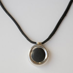 Unique pebble silver pendant on cowhide chain