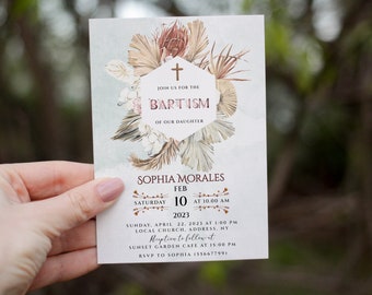 May include: A white baptism invitation with a cross and floral design. The invitation reads "Join us for the Baptism of our daughter Sophia Morales, Saturday, February 10, 2023 at 10:00 AM. Sunday, April 22, 2023 at 1:00 PM, Local Church, Address, NY. Reception to follow at Sunset Garden Cafe at 15:00 PM. RSVP to Sophia (55667799)"