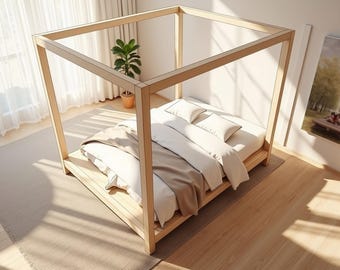 May include: A light wood canopy bed with white bedding and a tan blanket. The bed frame has a square design. A small potted plant sits near the bed. The room has hardwood floors and a large window with sheer curtains.
