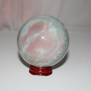 Unique Ocean Jasper Sphere with Free Red Wood Holder