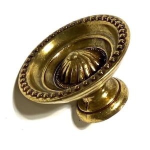 Beaded Lancaster Style Drawer Pull in Antique English Finish Measuring 1-1/4" in Diameter.