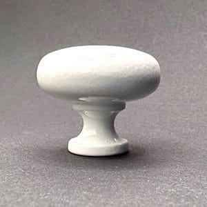 Rounded Smooth White Ceramic over Cast Iron Knobs 1-1/4” wide