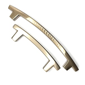 Tirador de cajón arqueado en bronce champán, acabado satinado, centro de 3" o 5", bordes rectos