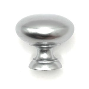May include: Silver-colored cabinet knob with an oval top and a decorative base. The knob has a smooth, reflective surface and is designed for easy gripping. This hardware is suitable for drawers and cabinets.