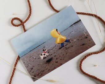 Illustration enfant avec sont chient sur la plage et sous la pluie, sur photo