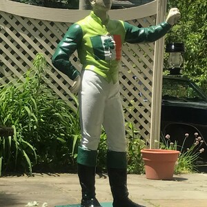 Statue of Irishman with Celtic Cross and Irish flag